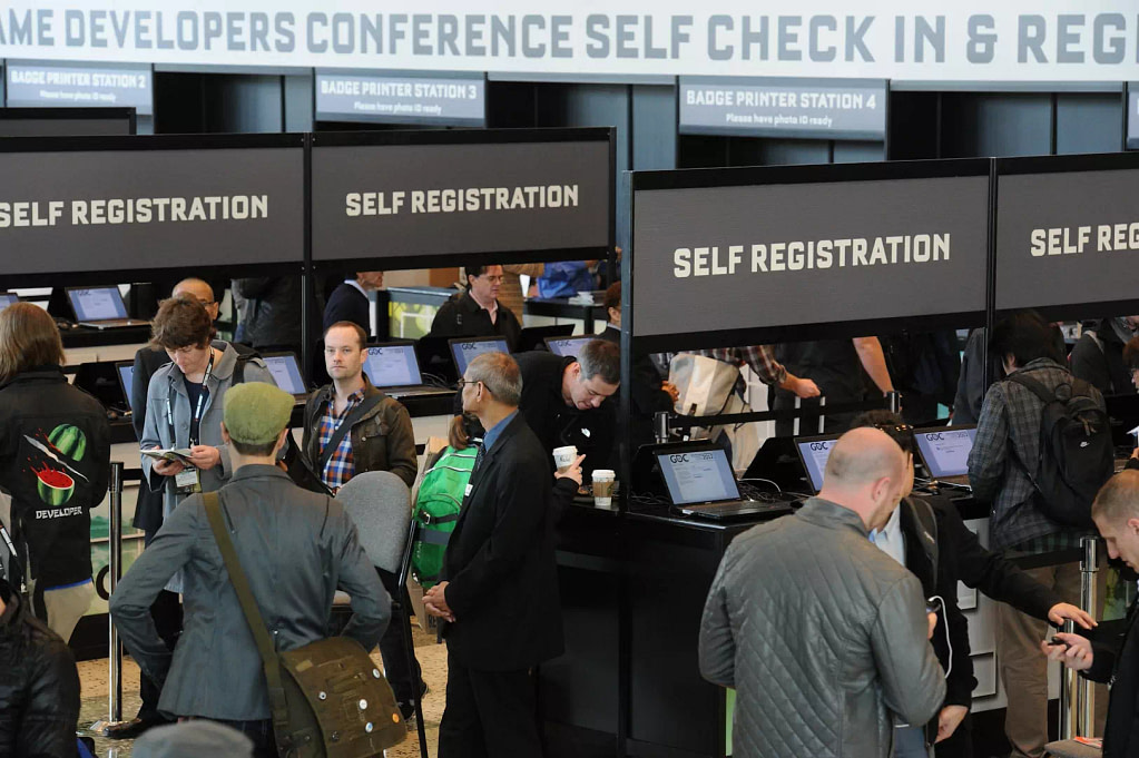 Attendees Using Self‑Registration Kiosks At Trade‑Show Check‑In