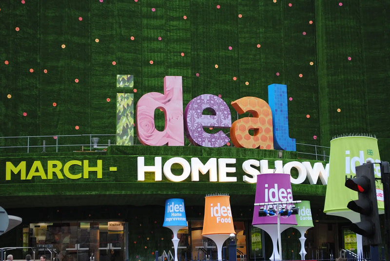 Colourful Ideal Home Show signage with decorative letters at the entrance of the exhibition in London.